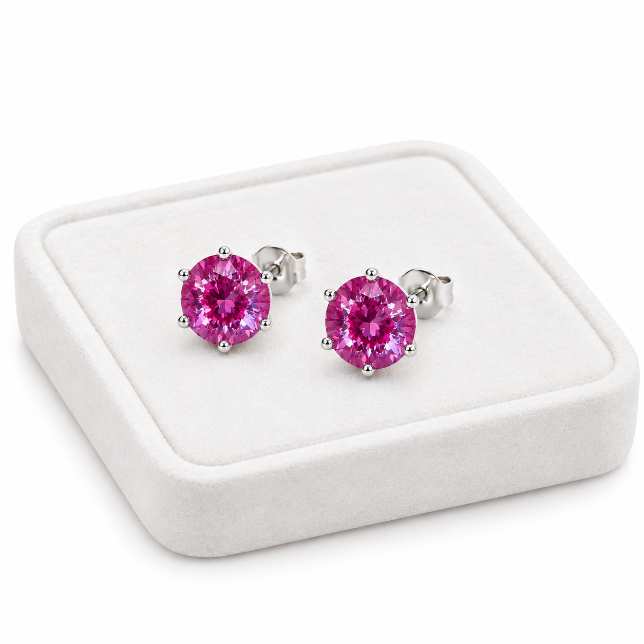 6mm lab created color changing alexandrite heart earrings displayed on white velvet jewelry tray