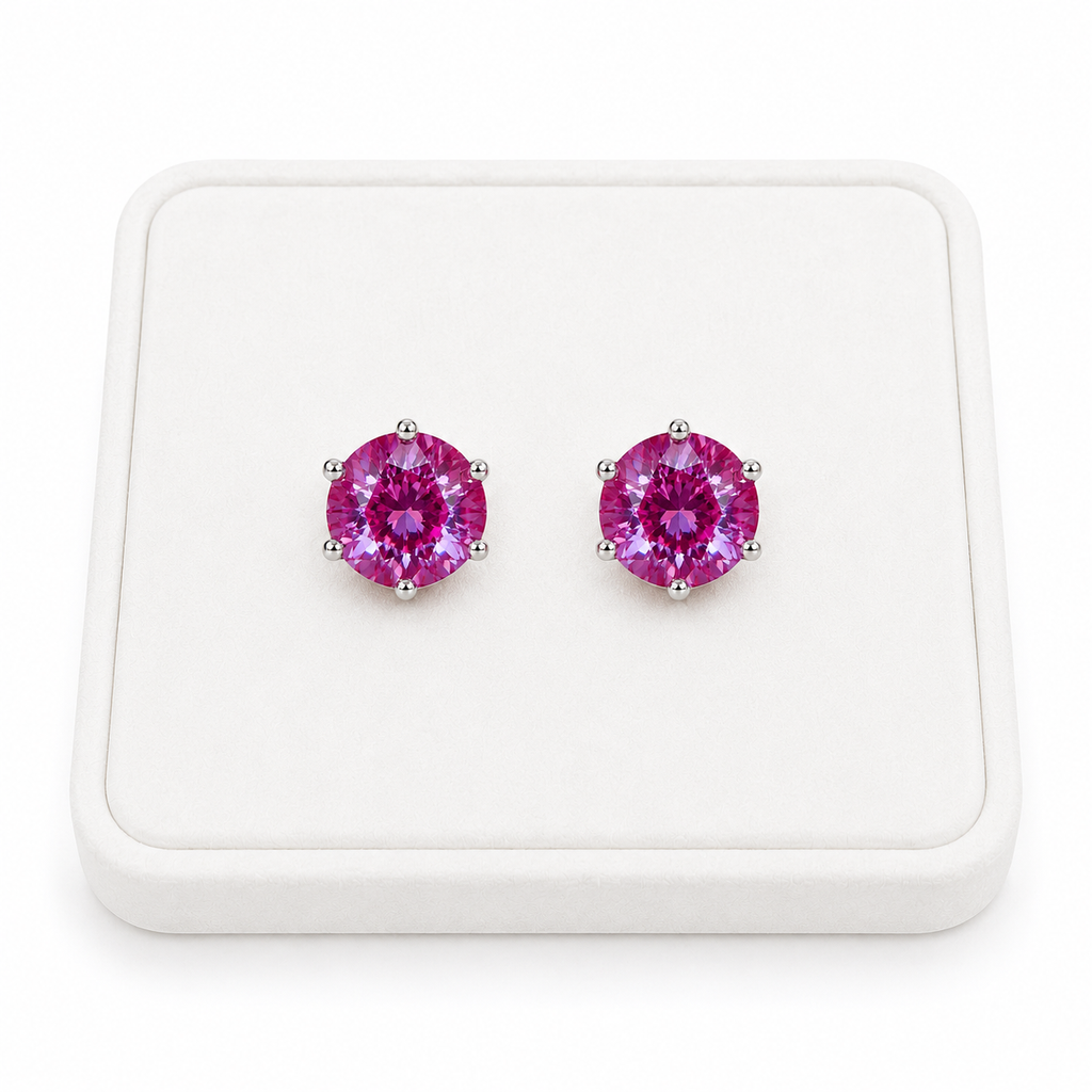 6mm lab created color changing alexandrite heart earrings displayed on white velvet jewelry tray