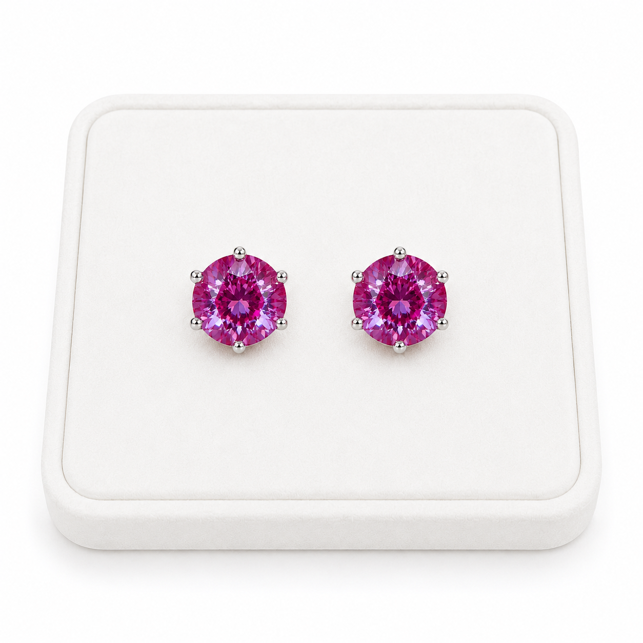 6mm lab created color changing alexandrite heart earrings displayed on white velvet jewelry tray