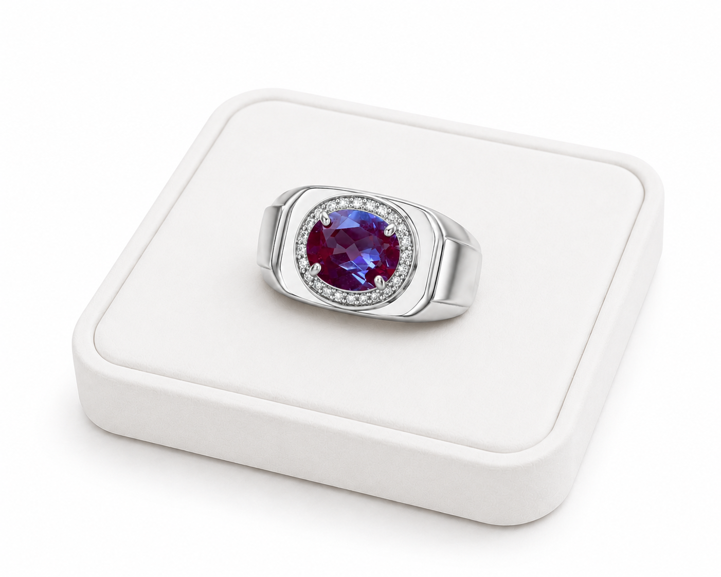 Men's 7x9mm color changing lab alexandrite ring displayed on white velvet jewelry tray