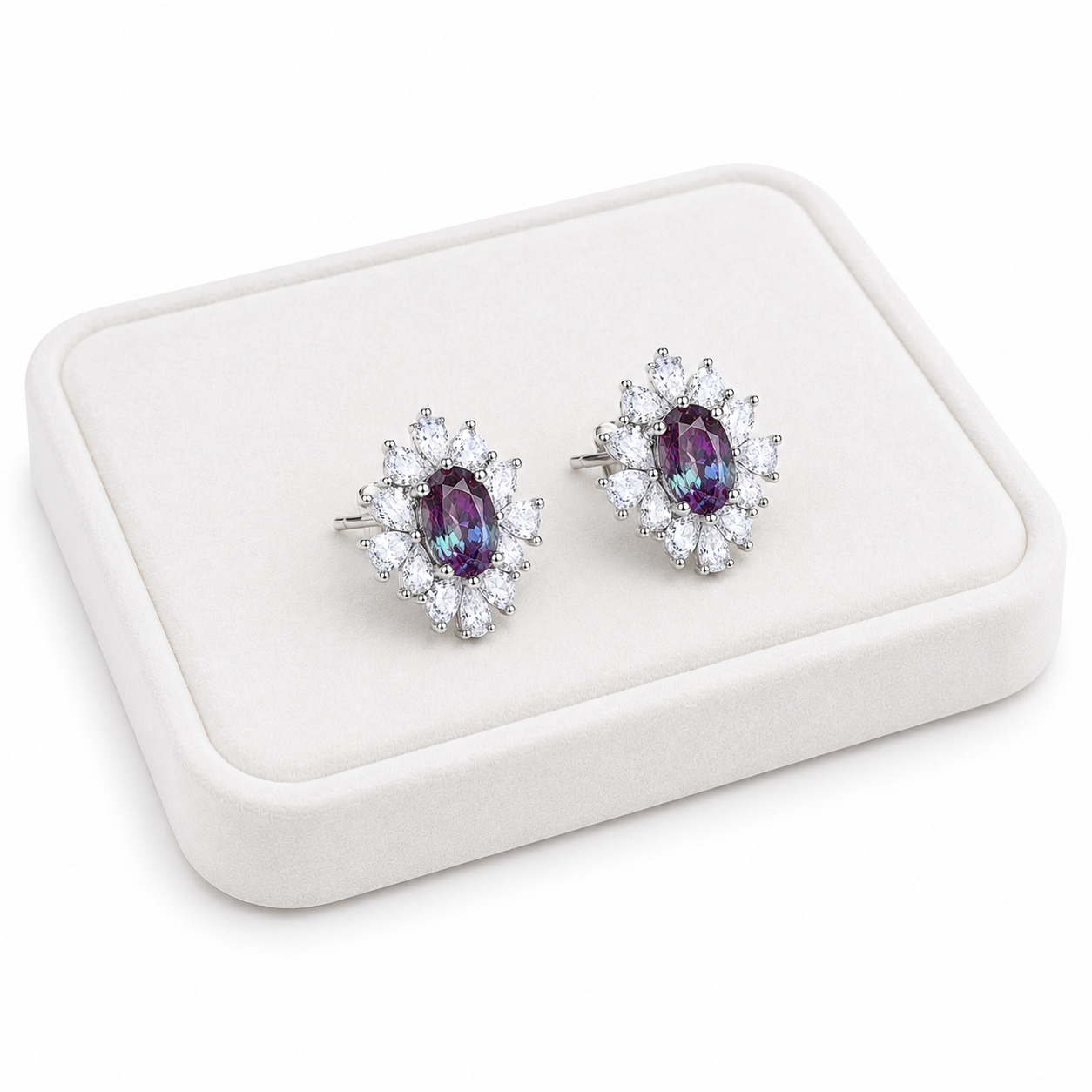 4x6mm oval lab alexandrite floral stud earrings displayed on a white velvet jewelry tray