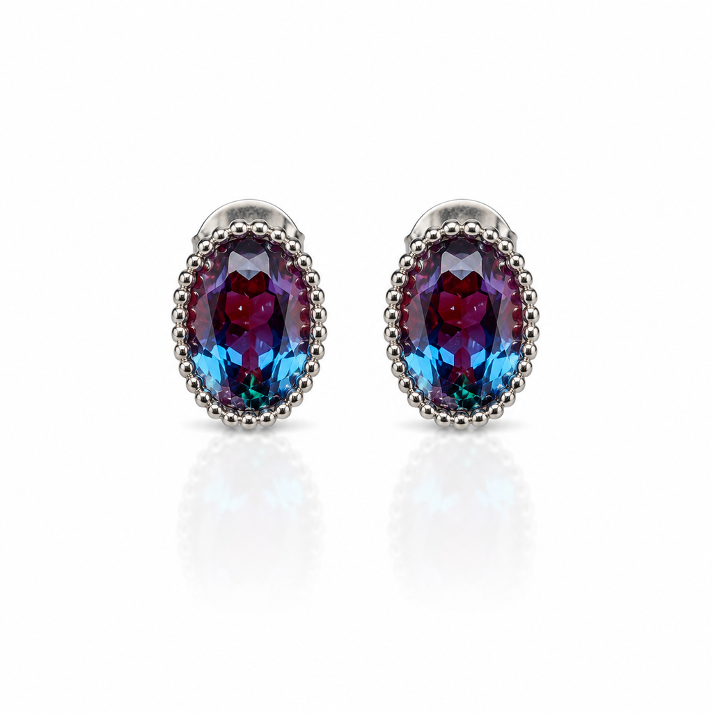 5x7mm oval lab-created alexandrite stud earrings in 925 sterling silver on a white background