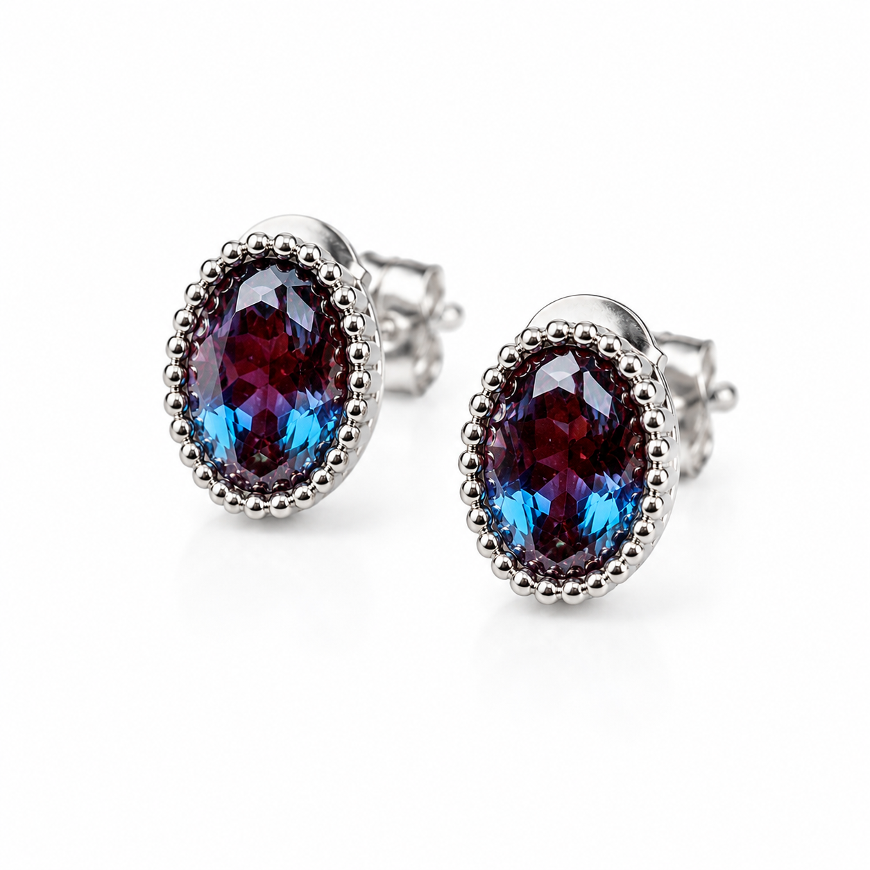 5x7mm oval lab-created alexandrite earrings showing purple and blue color-shifting gemstone facets