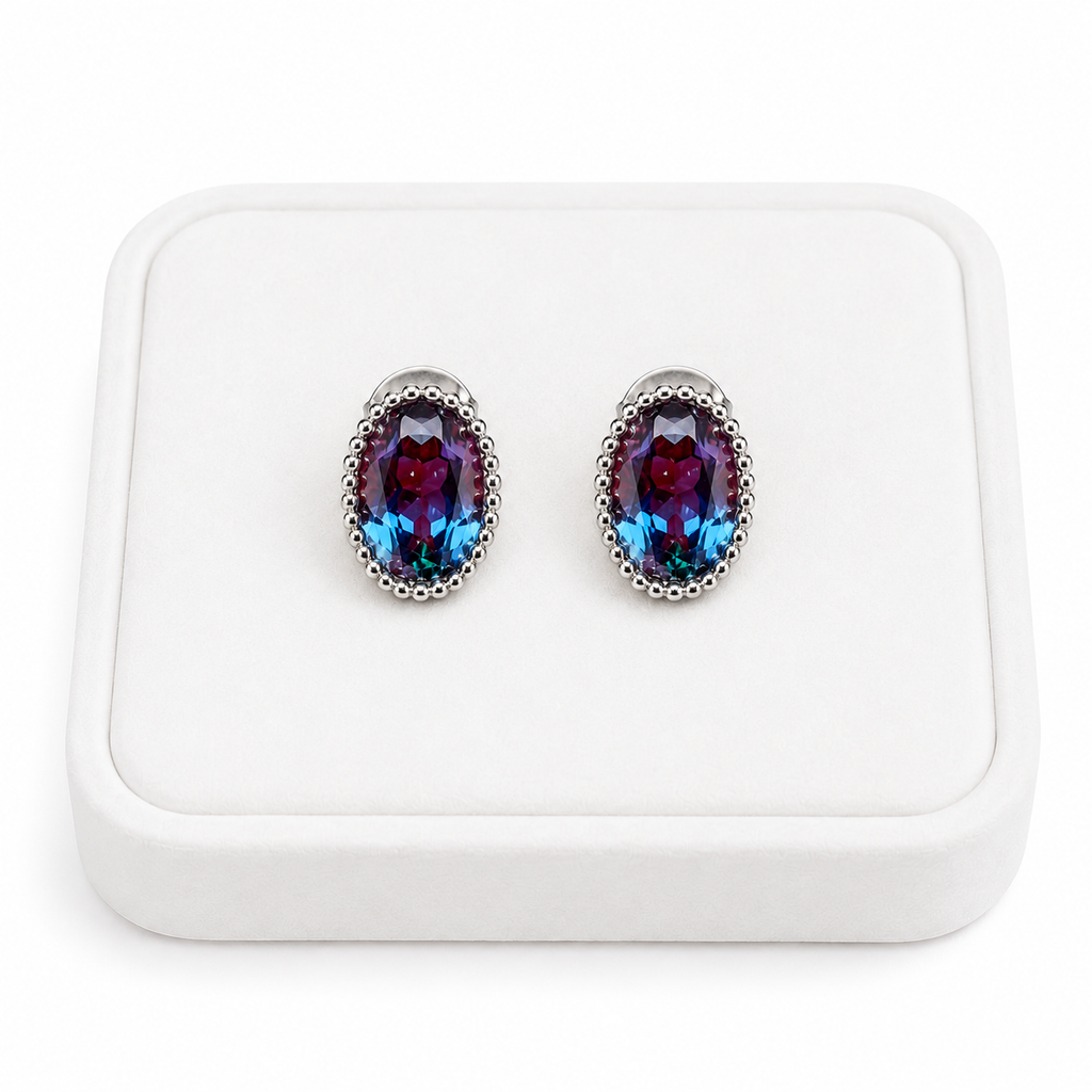 5x7mm oval lab-created alexandrite earrings displayed on a white velvet jewelry tray