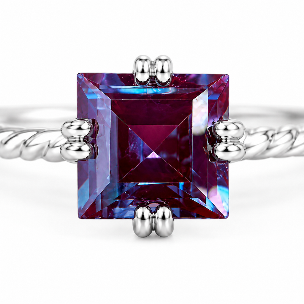 Macro view of 7mm square cut lab alexandrite ring showing faceted purple magenta and blue-violet gemstone
