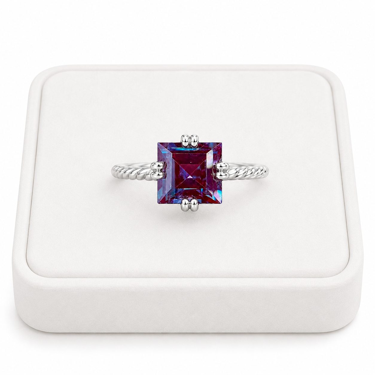 7mm square cut lab alexandrite ring displayed on a white velvet jewelry tray