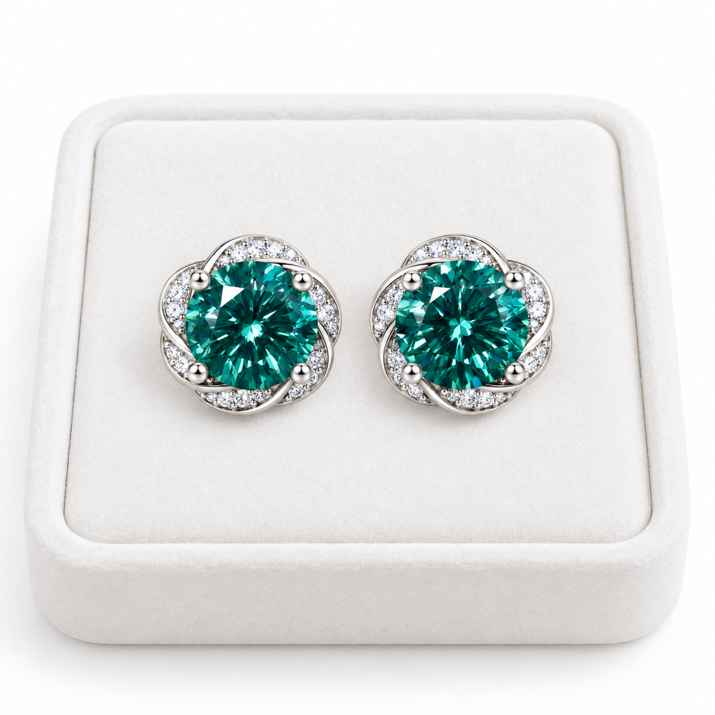 Pair of 6.5mm green moissanite earrings displayed on a white velvet jewelry tray