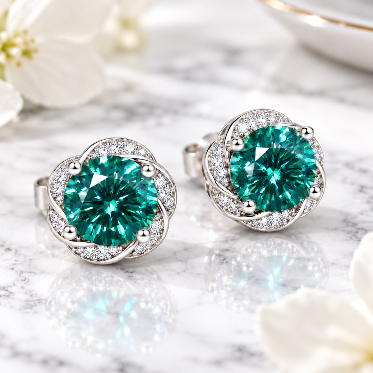 Lab created green moissanite earrings featuring 6.5mm VVS1 round brilliant cut gemstones styled in an elegant jewelry setting