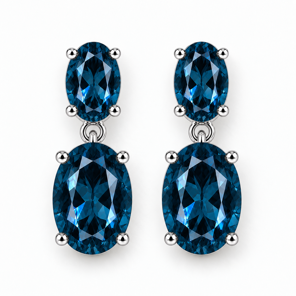 London Blue Topaz earrings featuring two faceted oval gemstones in 925 sterling silver