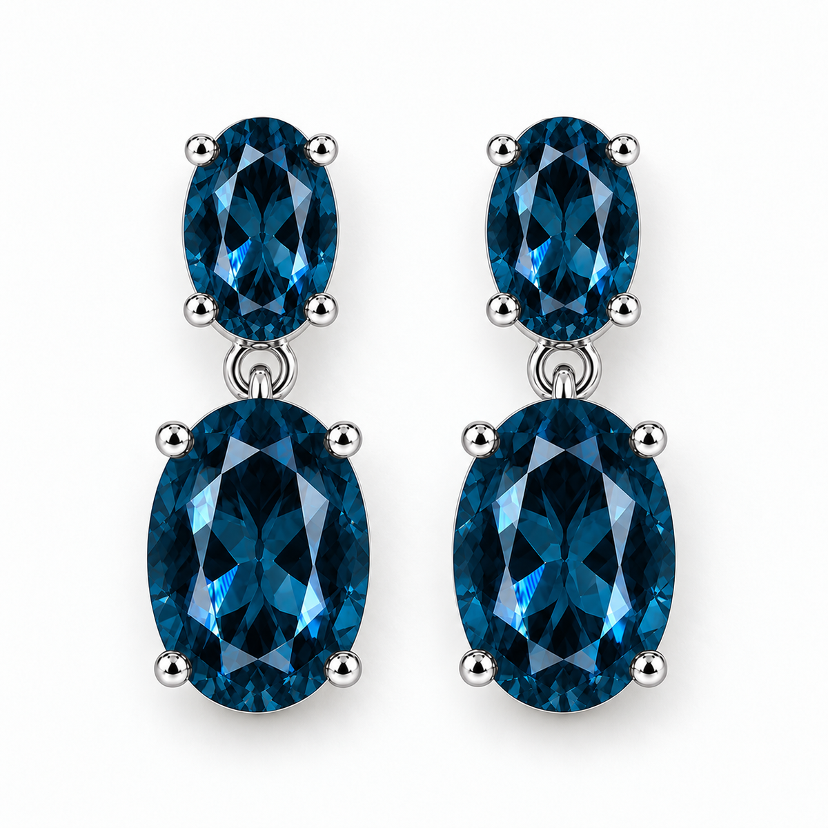 London Blue Topaz earrings featuring two faceted oval gemstones in 925 sterling silver
