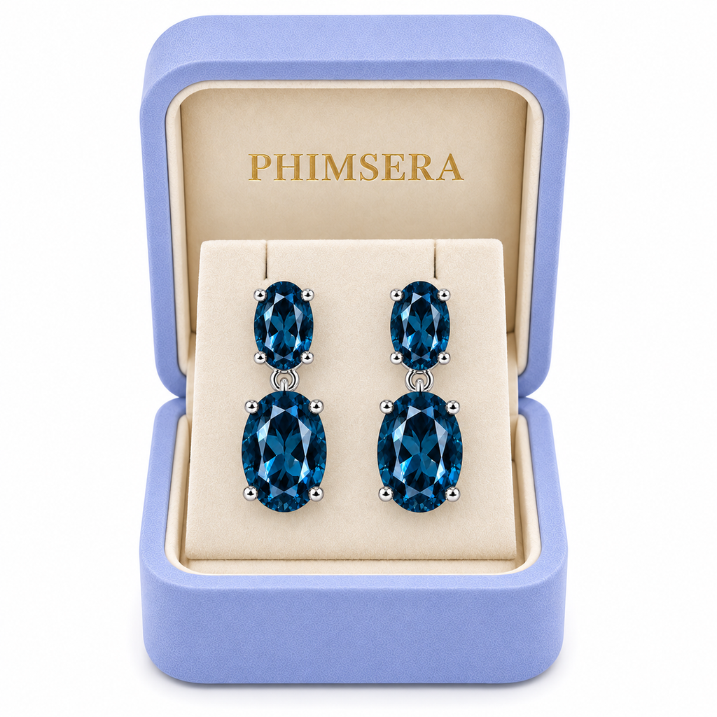 London Blue Topaz dangle earrings displayed in a Phimsera jewelry box