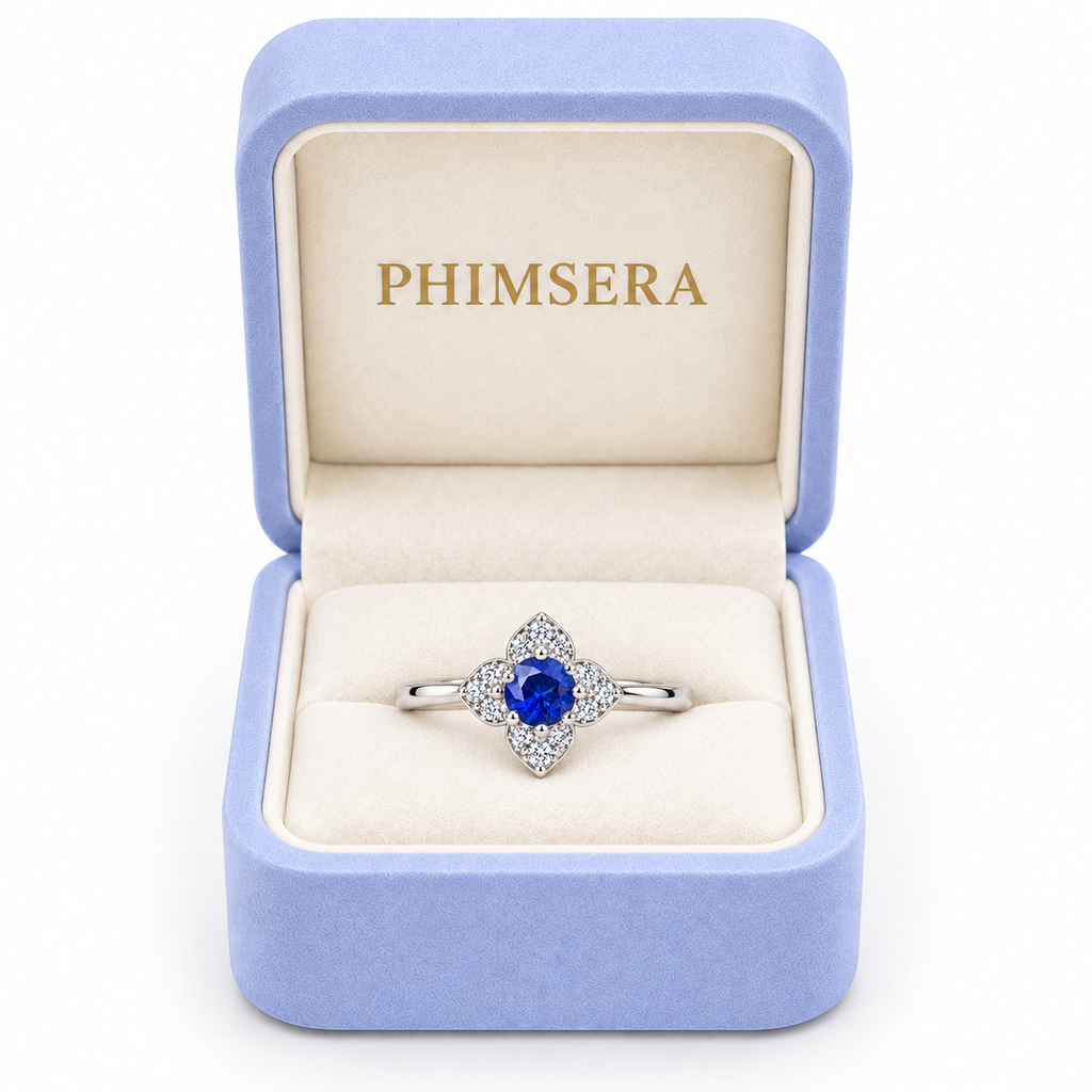 Natural 3.5mm blue sapphire floral ring presented inside a Phimsera jewelry gift box
