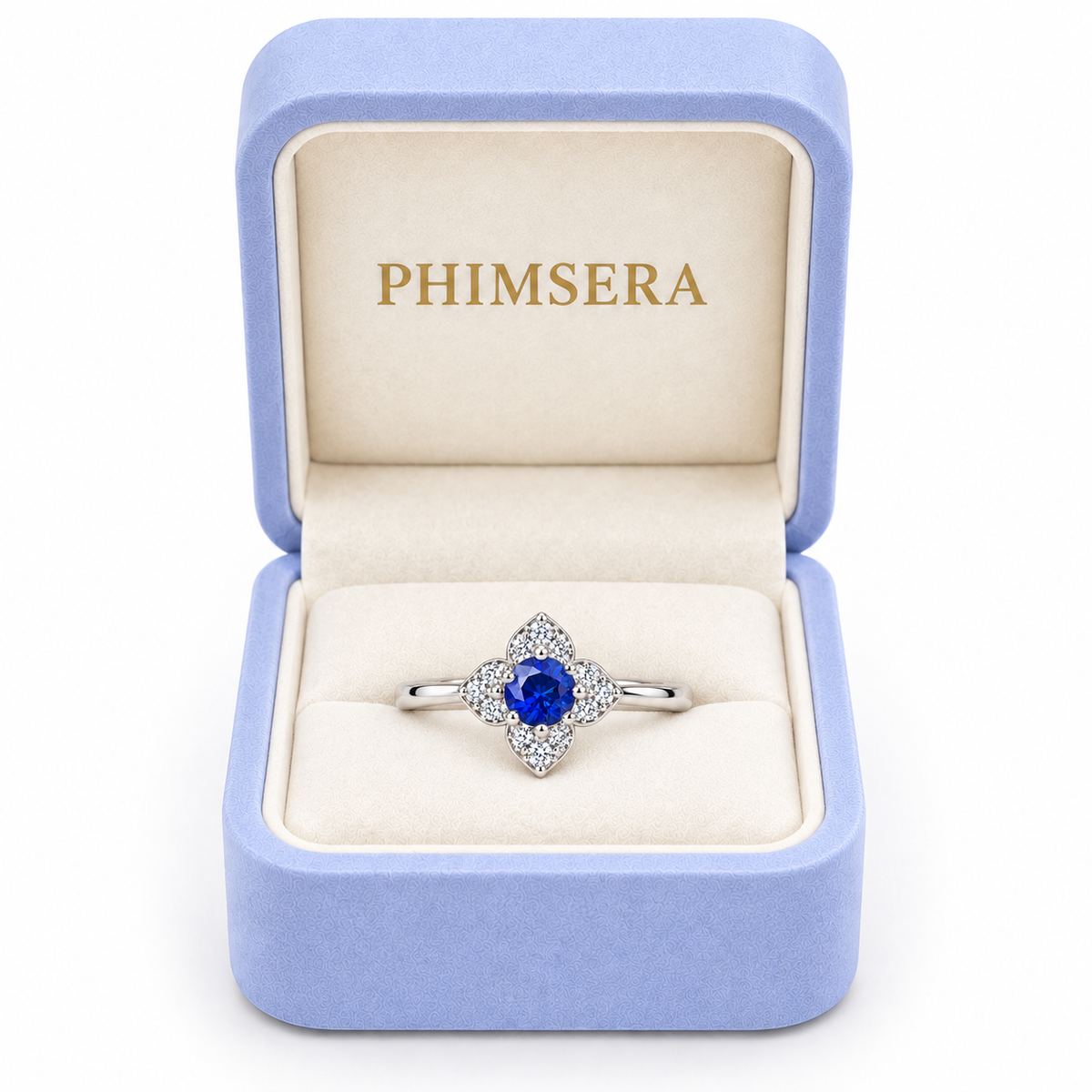 Natural 3.5mm blue sapphire floral ring presented inside a Phimsera jewelry gift box