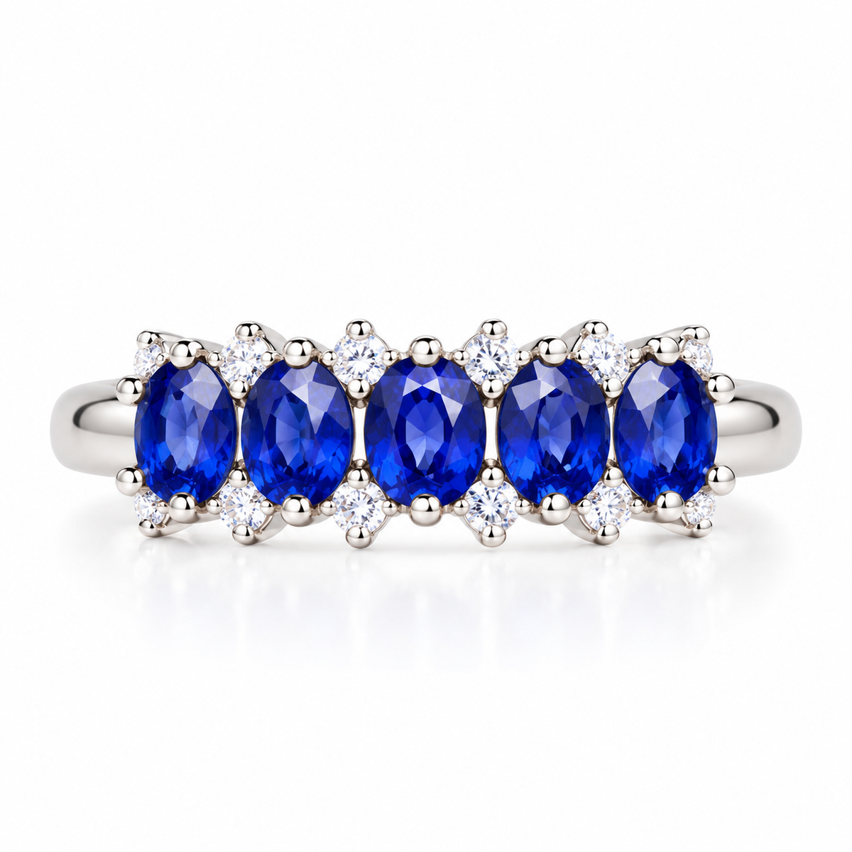 Natural 3×4mm blue sapphire band ring with oval gemstones in 925 Sterling Silver on a pure white background