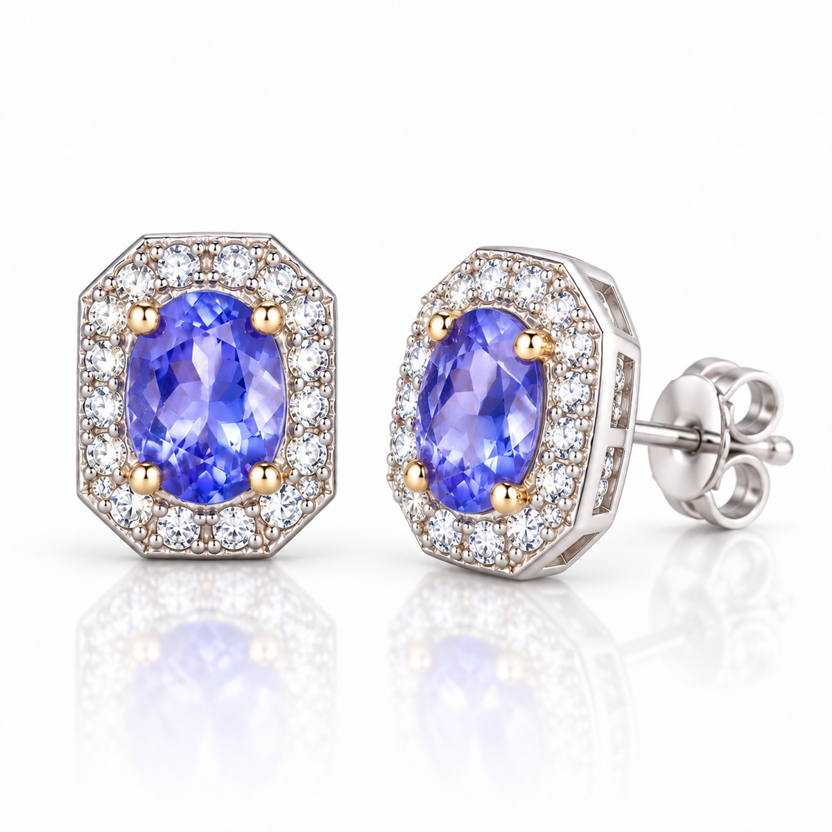 Phimsera natural 4×5mm tanzanite stud earrings shown at a 45-degree angle with faceted violet-blue gemstones and sparkling halo accents