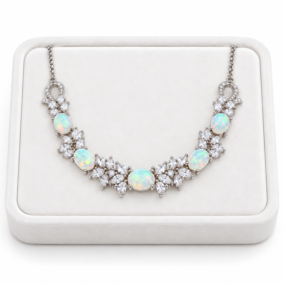 Natural 5x7mm oval fire opal necklace displayed on a white velvet jewelry tray