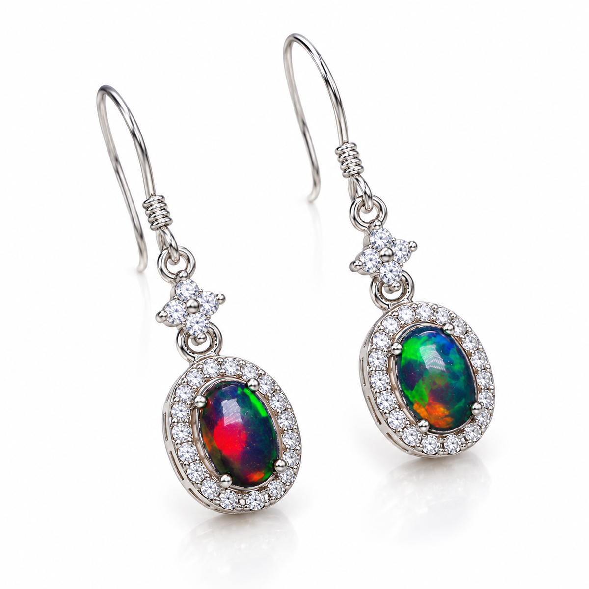 Natural Australian 5x7mm colorful fire opal earrings shown from an angled view with Cubic Zirconia accents