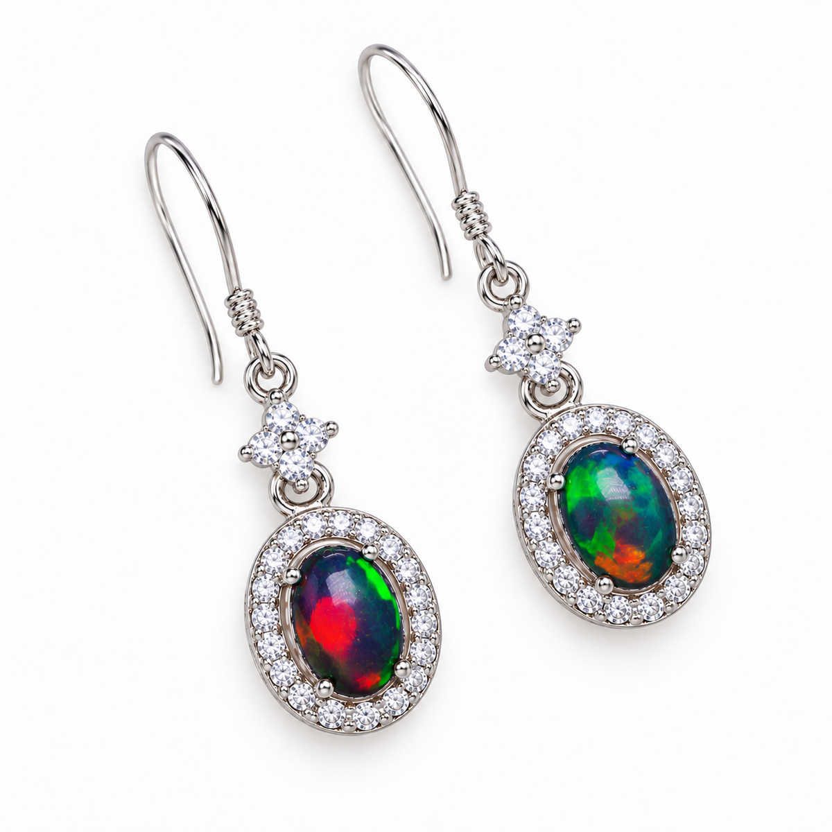 Top-down view of natural Australian opal earrings featuring 5x7mm colorful fire opal gemstones