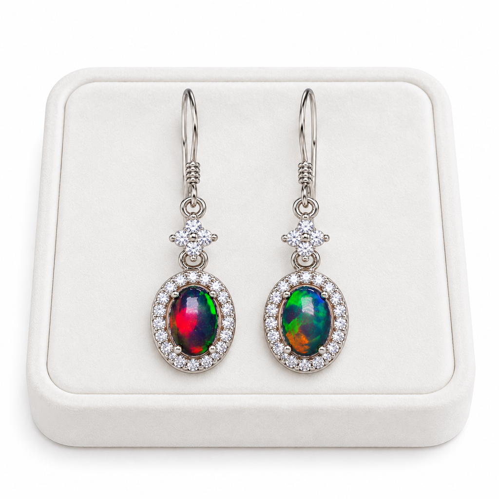 5x7mm natural Australian opal earrings displayed on a white velvet jewelry tray