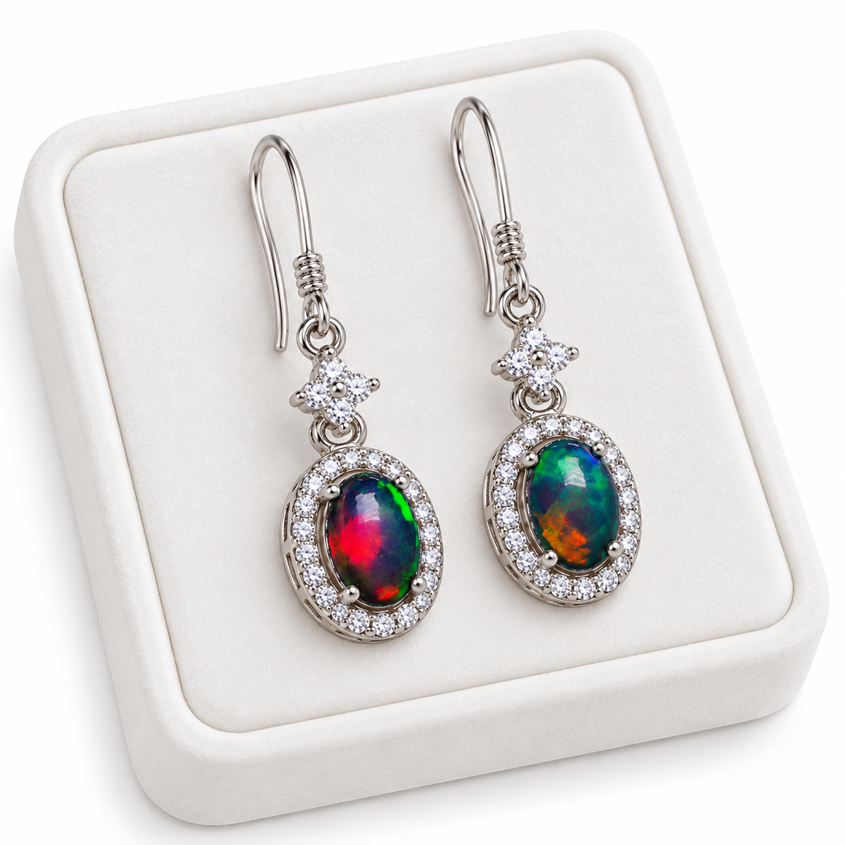 5x7mm natural Australian opal earrings displayed on a white velvet jewelry tray