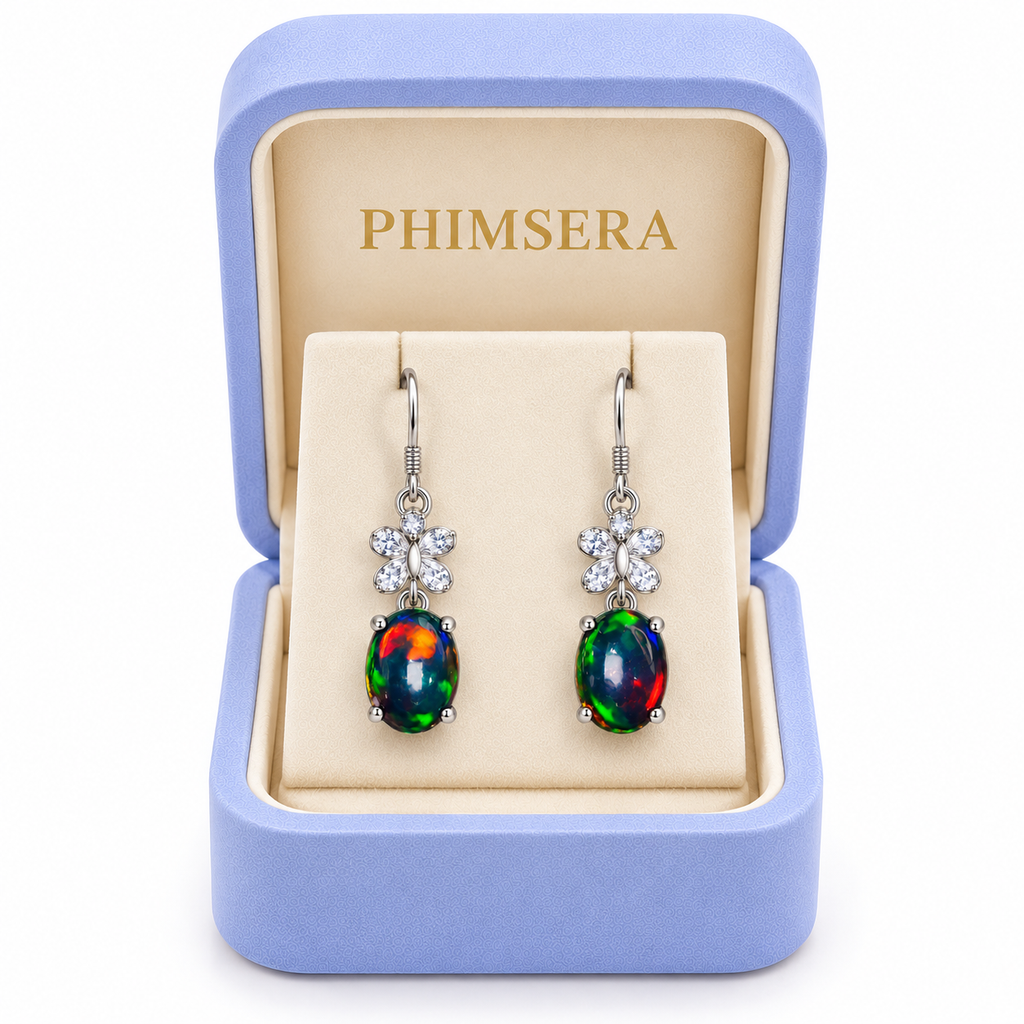 Natural black fire opal dangle earrings presented in a Phimsera jewelry gift box