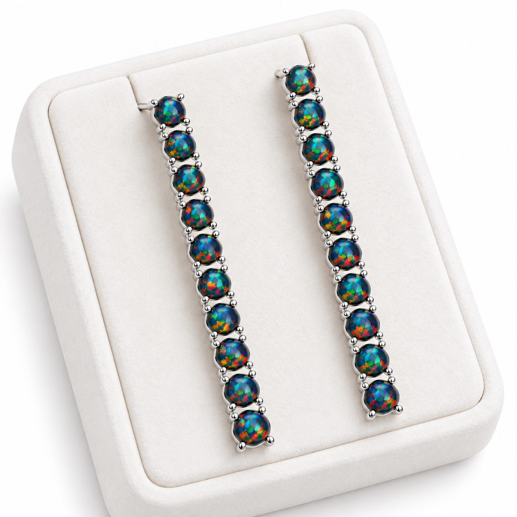 Natural Black Fire Opal earrings displayed on a white velvet jewelry tray