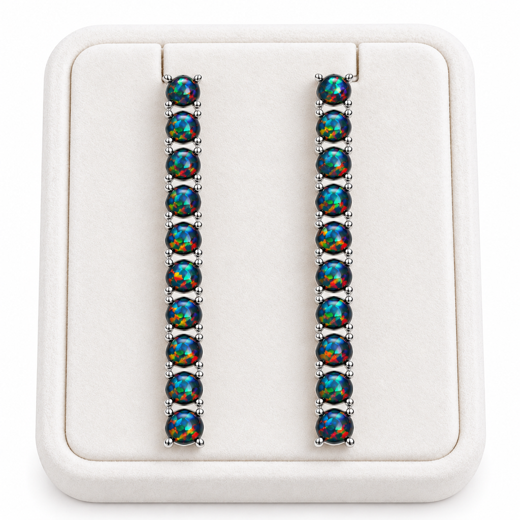 Natural Black Fire Opal earrings displayed on a white velvet jewelry tray