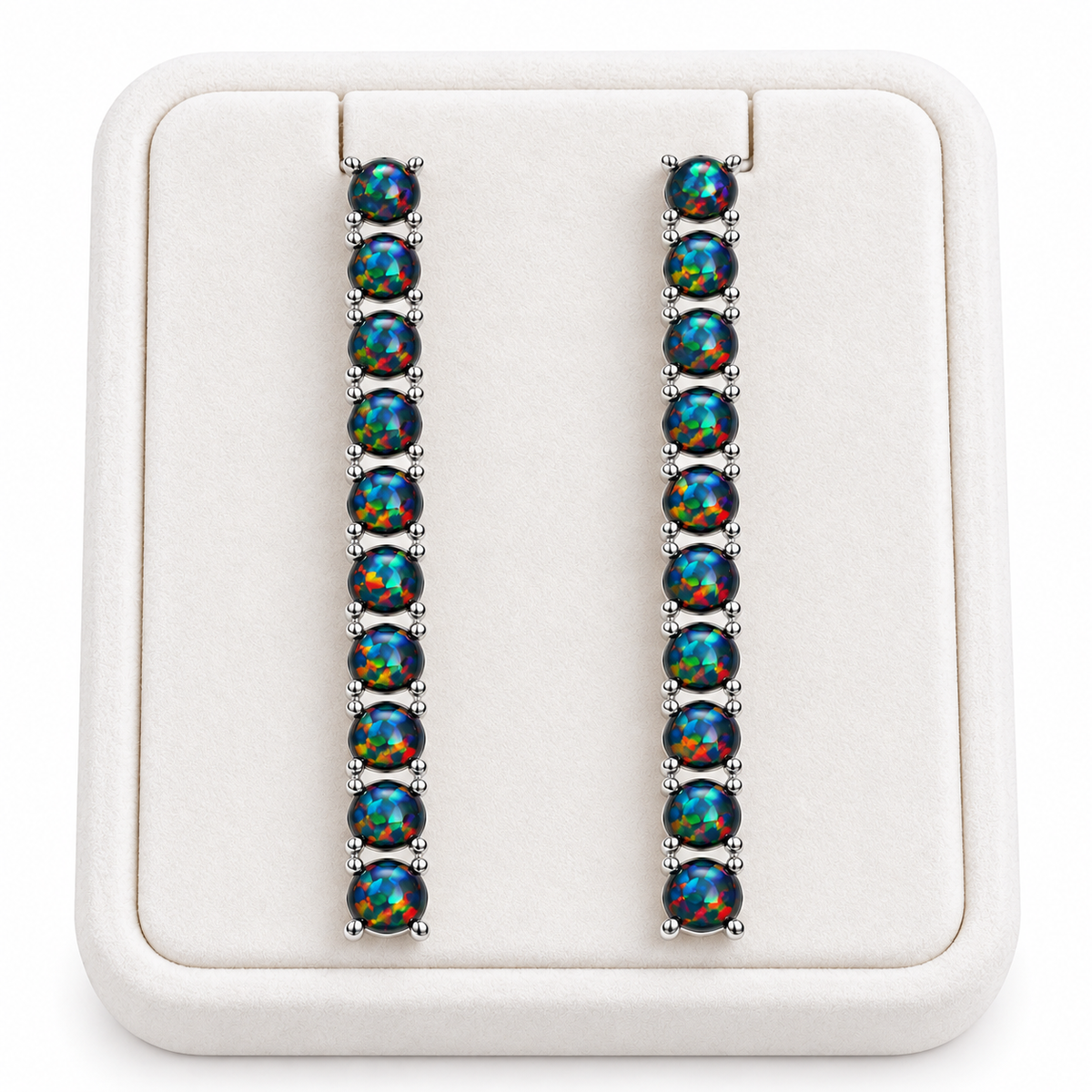 Natural Black Fire Opal earrings displayed on a white velvet jewelry tray