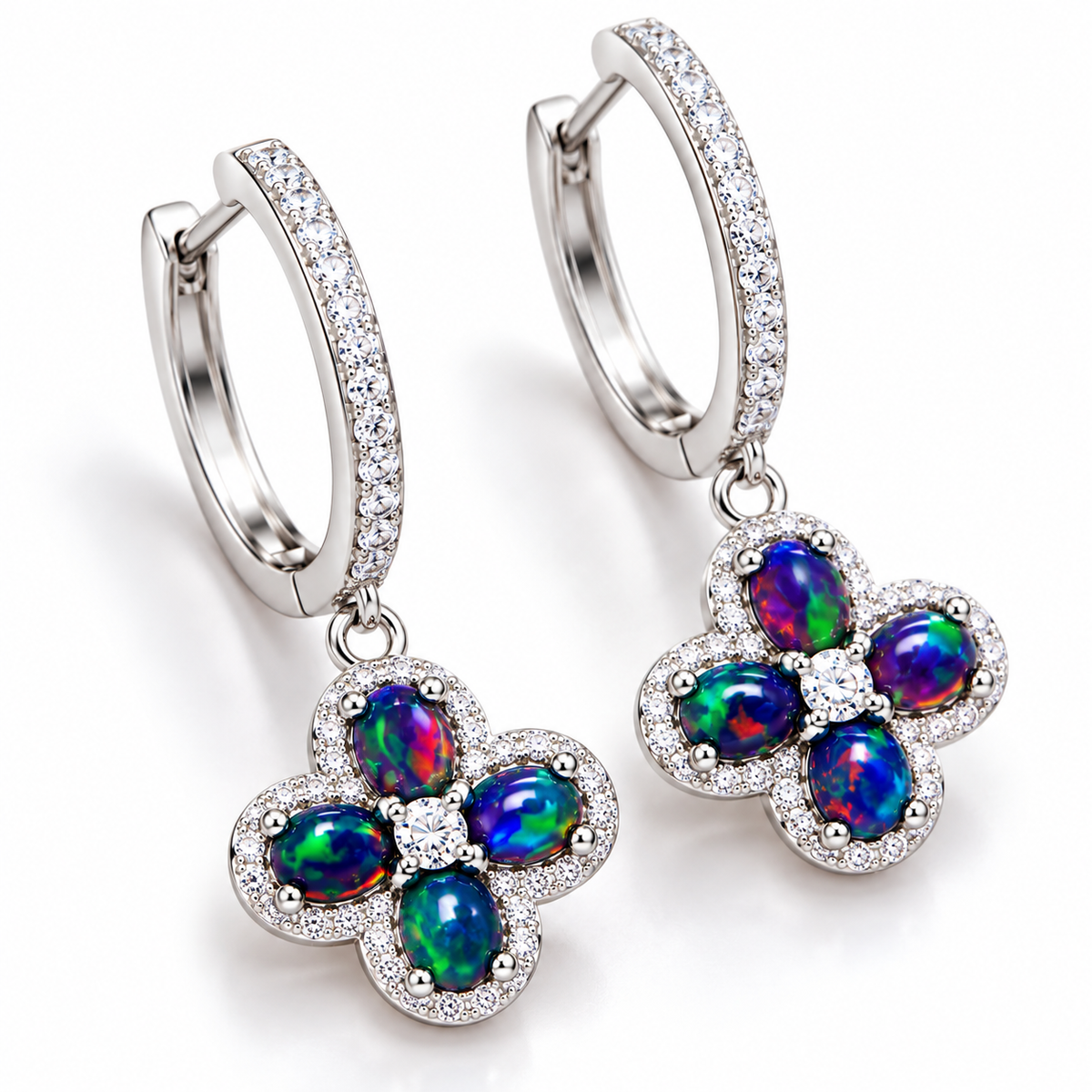 Natural black fire opal hoop earrings 4x5mm shown at an angled view with floral gemstone drops and 925 Sterling Silver hoops