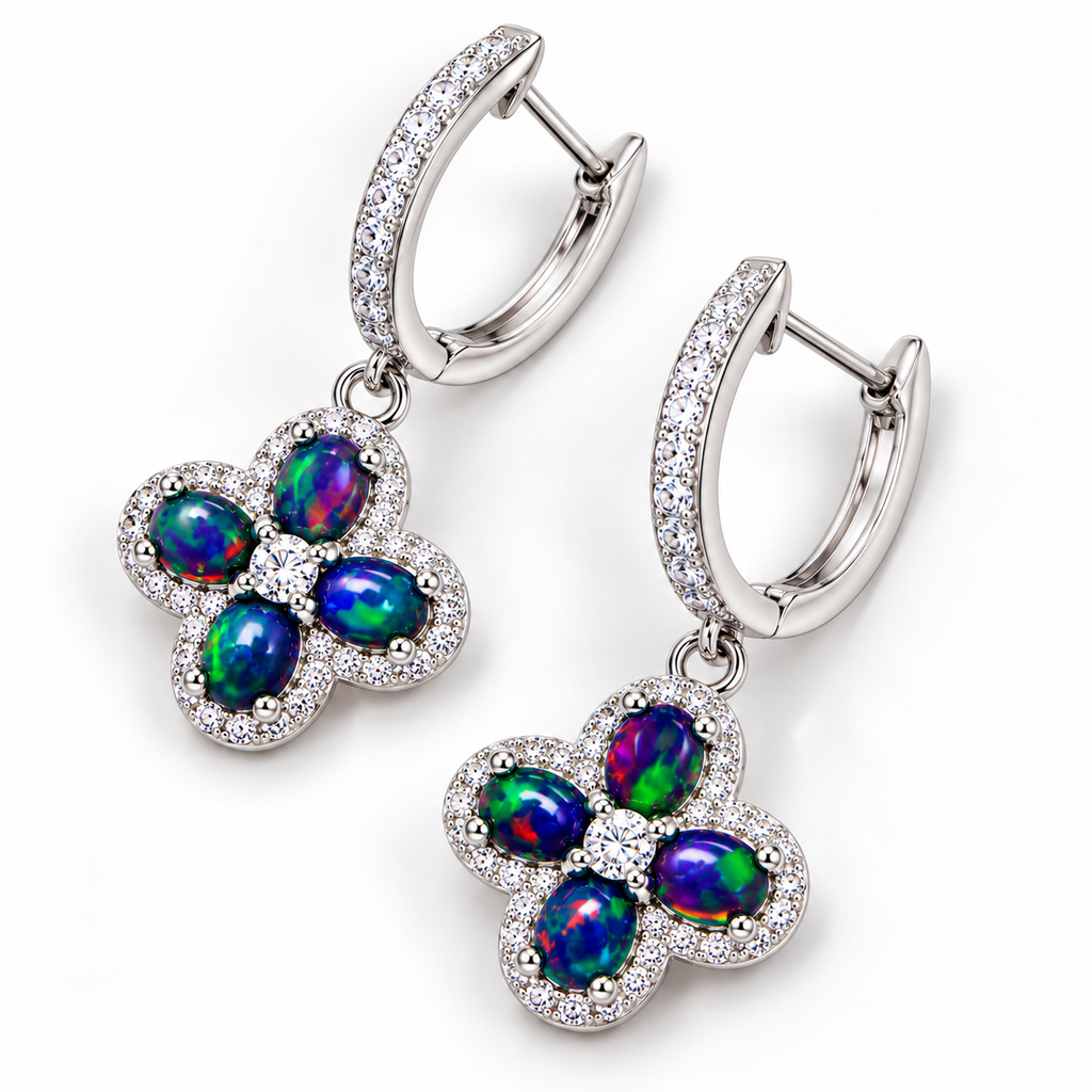 Top-down view of natural black fire opal hoop earrings with 4x5mm gemstones and floral detailing