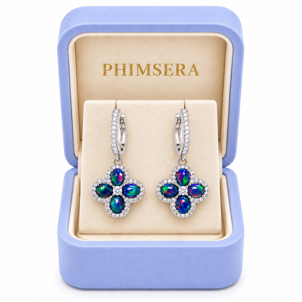 Phimsera natural black fire opal hoop earrings with 4x5mm gemstones displayed in a Phimsera jewelry box