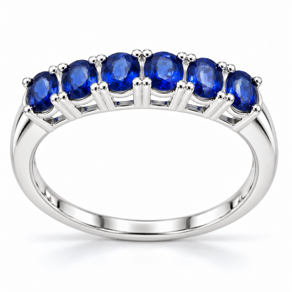 Side profile of a Phimsera blue sapphire band ring showing the gemstone arrangement and polished silver-tone ring setting