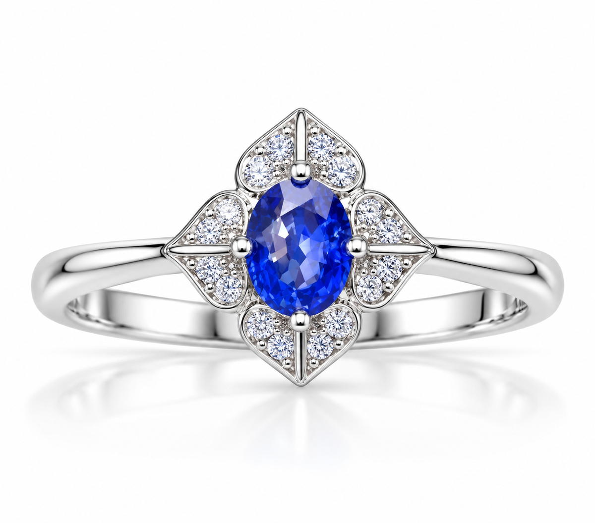 Natural 4×5mm oval blue sapphire floral ring in 925 Sterling Silver on a clean white background