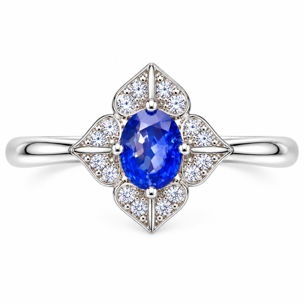 Top-down view of a natural 4×5mm blue sapphire ring with symmetrical four-petal floral detailing