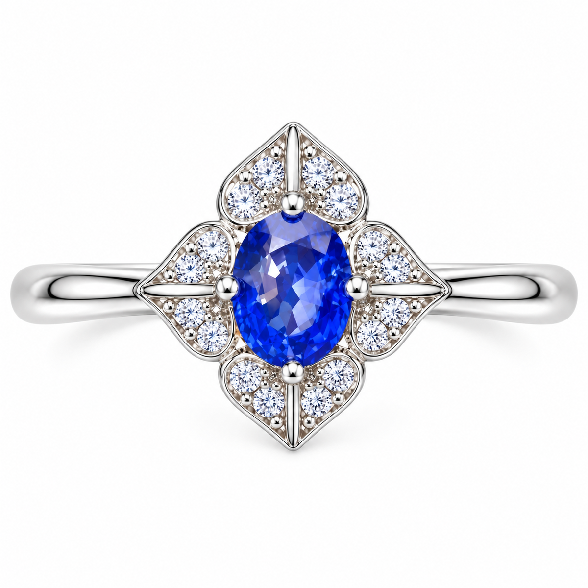 Top-down view of a natural 4×5mm blue sapphire ring with symmetrical four-petal floral detailing