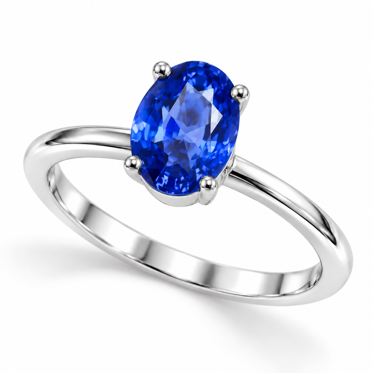 Angled view of 5x7mm oval blue sapphire solitaire ring in polished sterling silver