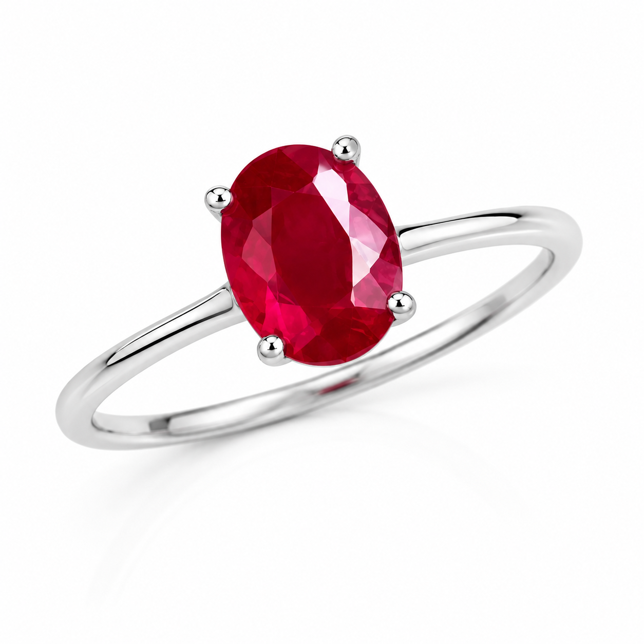 Angled view of 6x8mm oval ruby gemstone ring in polished 925 sterling silver