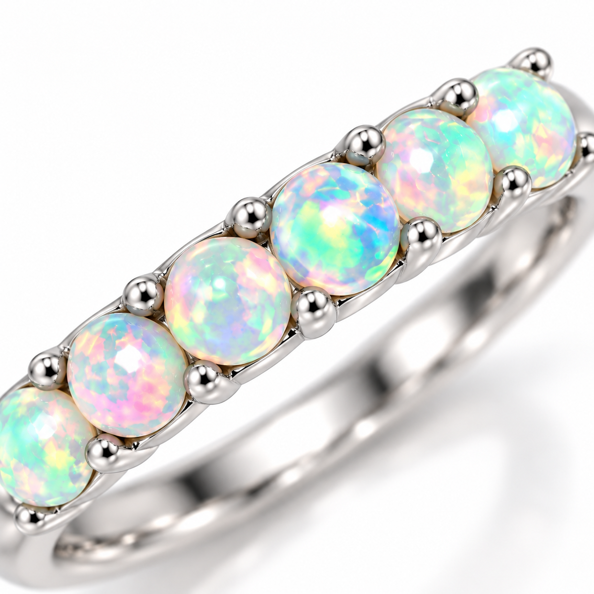 Close-up macro of colorful natural fire opal gemstones in a stackable ring