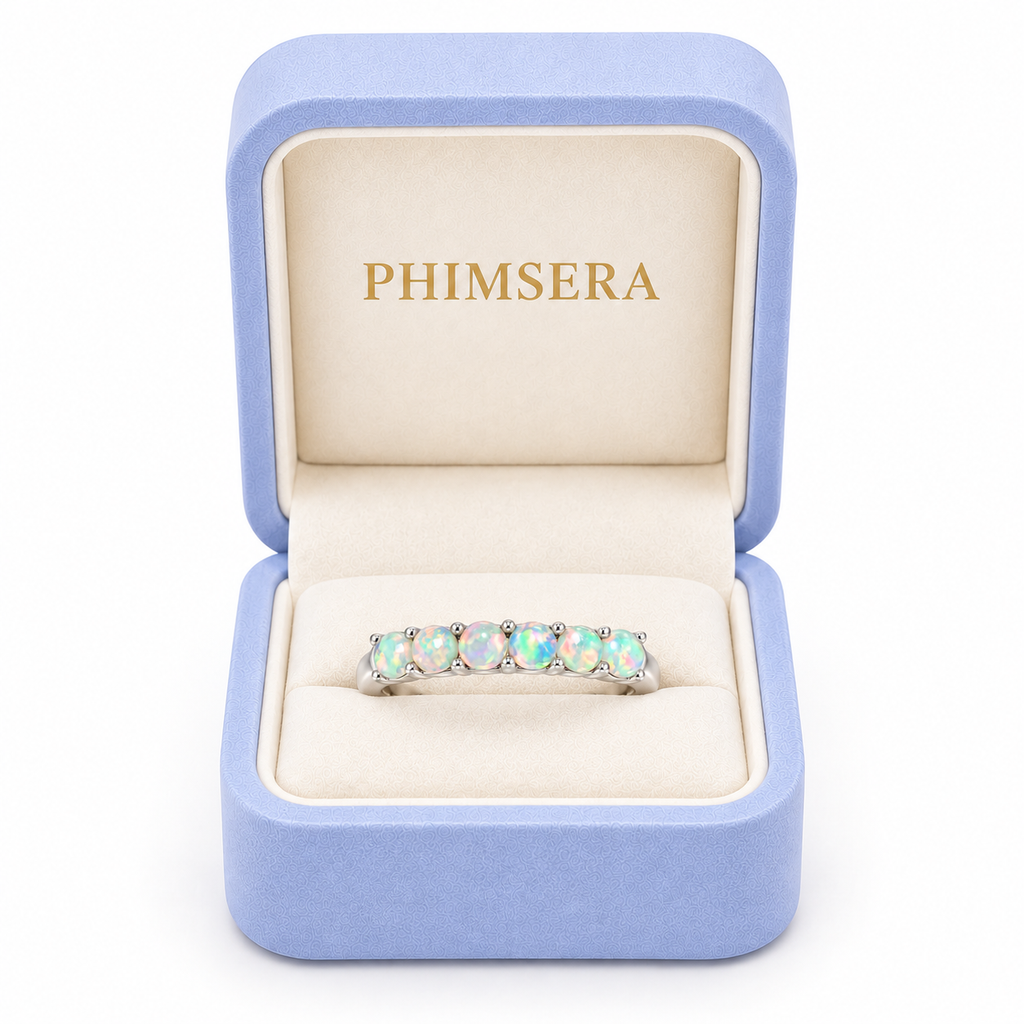 Phimsera natural fire opal band ring presented in a luxury jewelry gift box