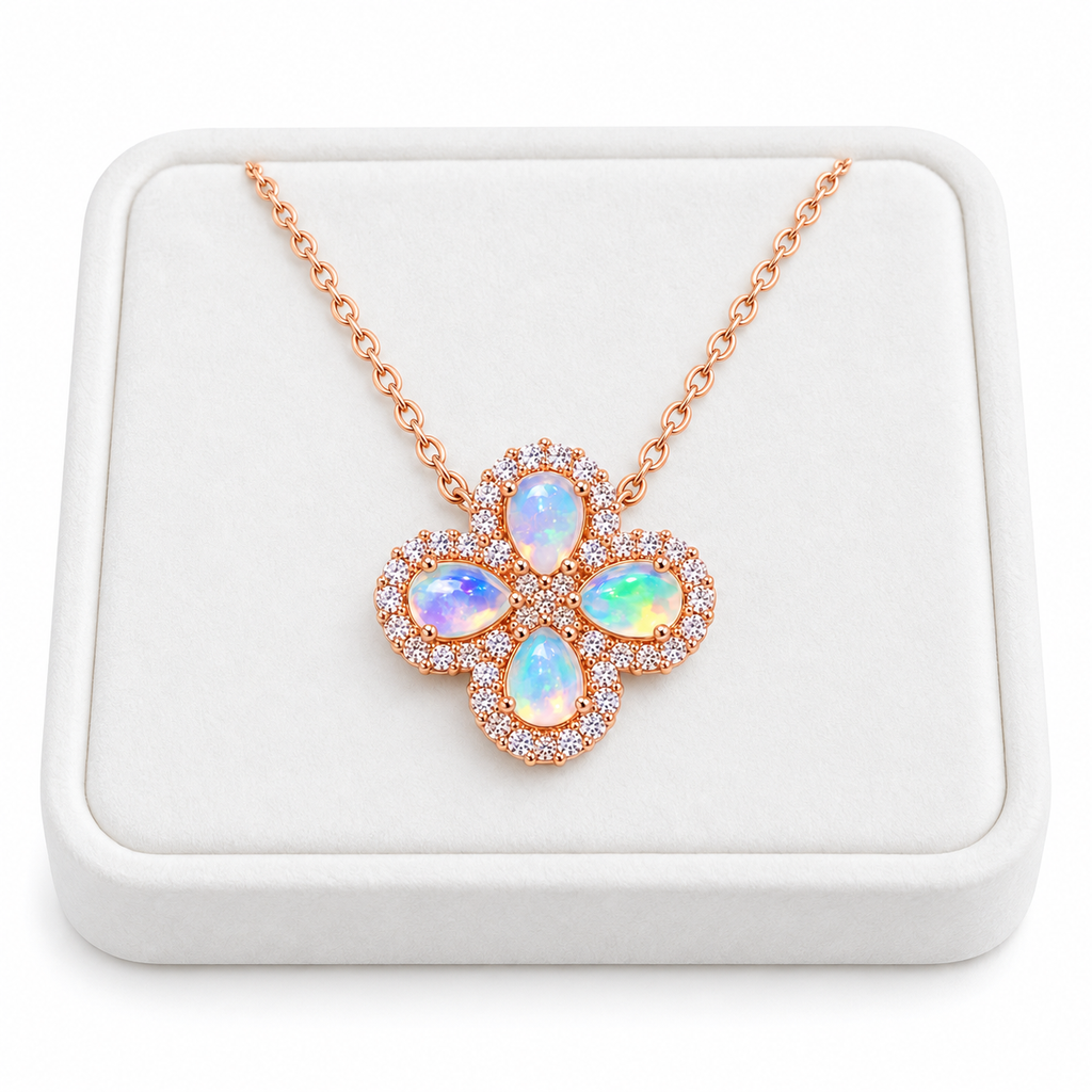 Natural fire opal floral cluster necklace displayed on a white velvet jewelry tray against a clean white background