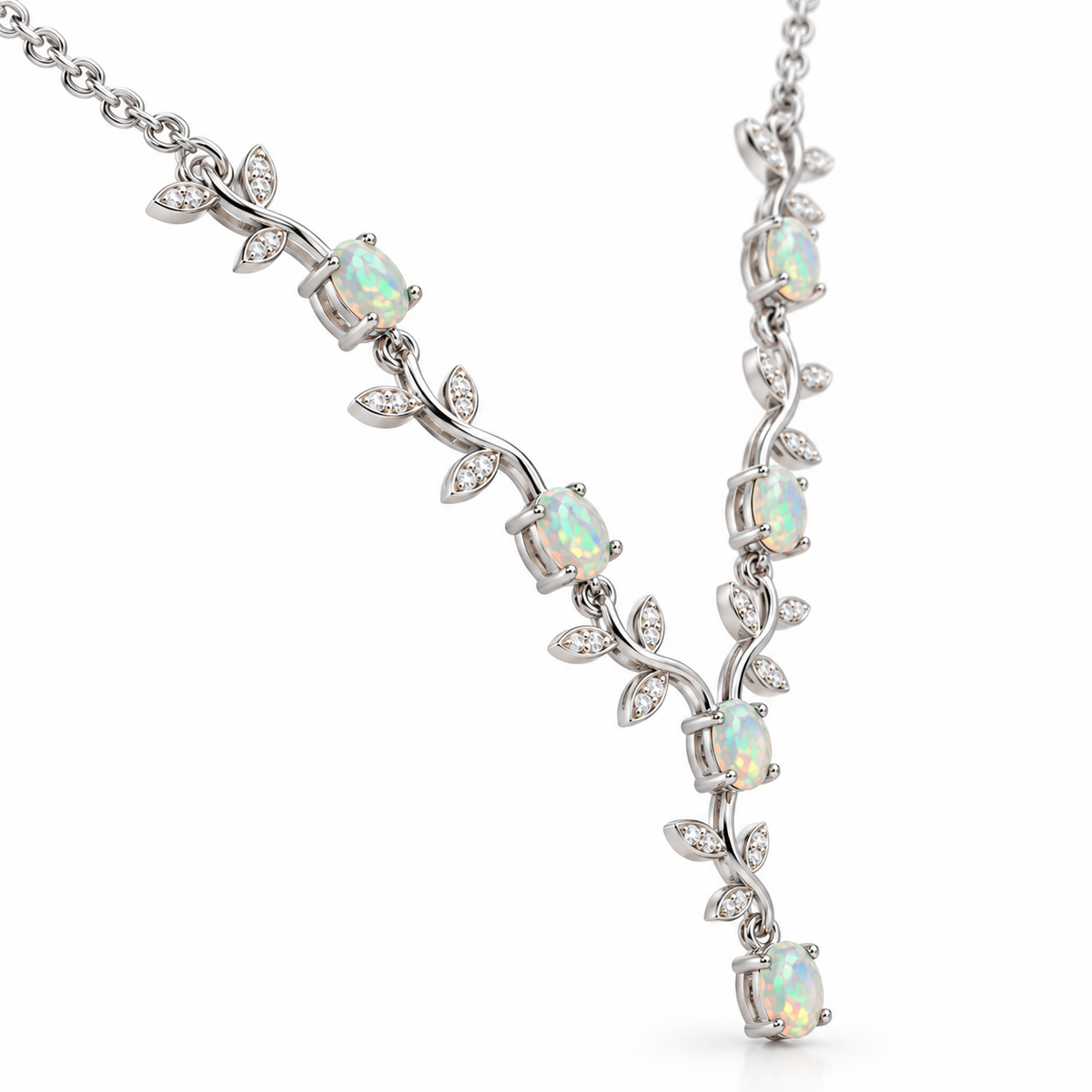 Side angle showing the vine design and 4x5mm oval opals on silver necklace
