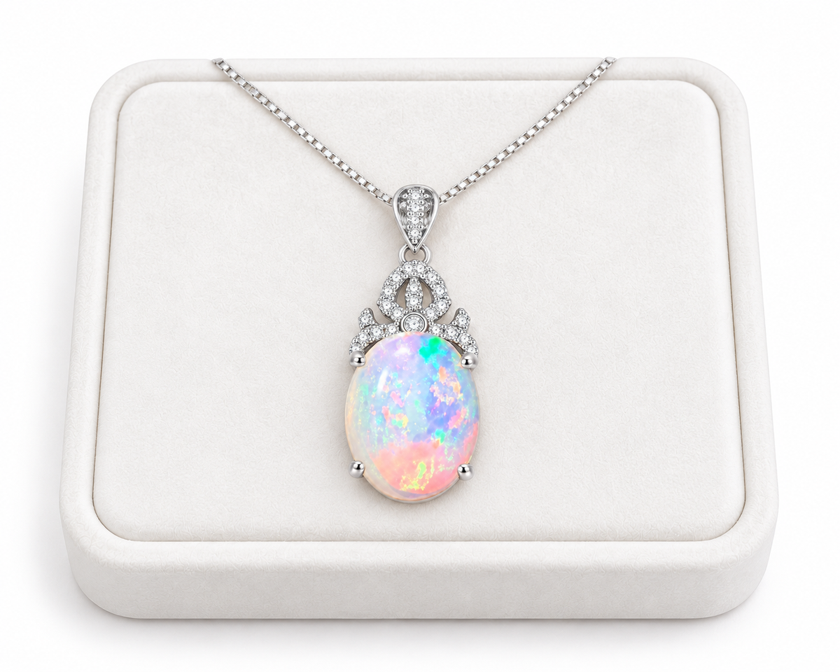Natural 10x14mm oval fire opal pendant necklace displayed on a white velvet jewelry tray