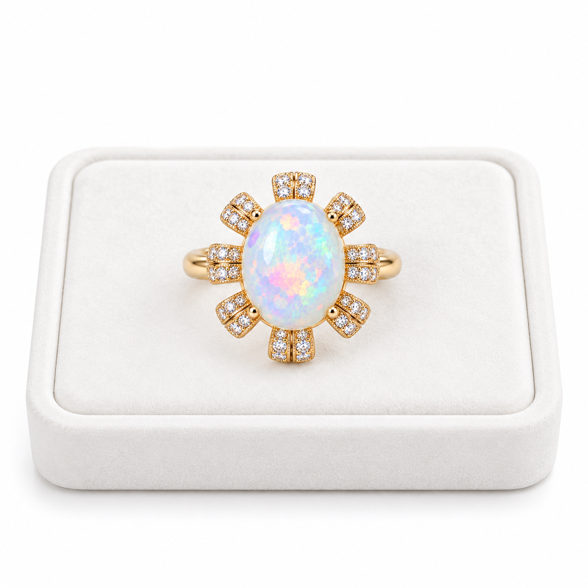 Natural 9x11mm oval fire opal ring displayed on a white velvet jewelry tray