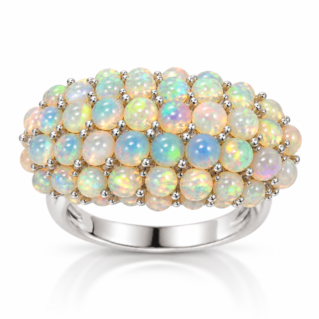 Natural opal cluster ring with multiple 3mm round gemstones shown at an angled view
