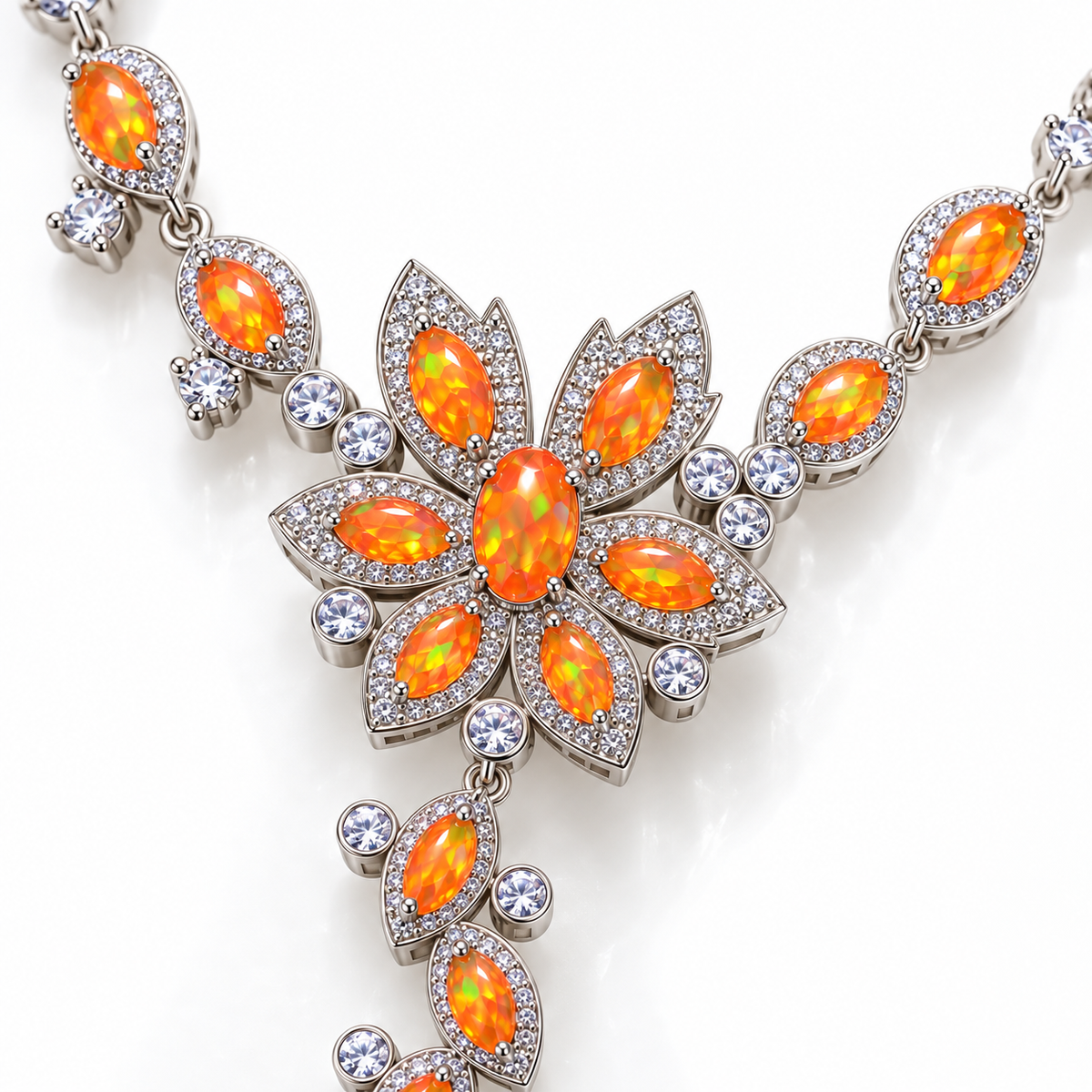 Close-up of 3x5mm orange Fire Opal gemstones and Sterling Silver settings