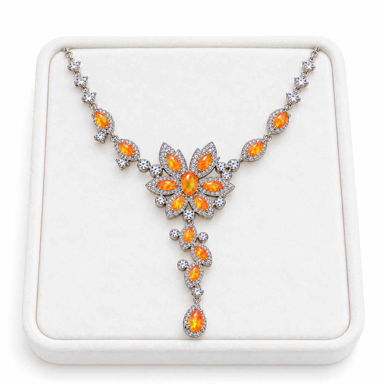 3x5mm orange Fire Opal necklace displayed on a white velvet jewelry tray