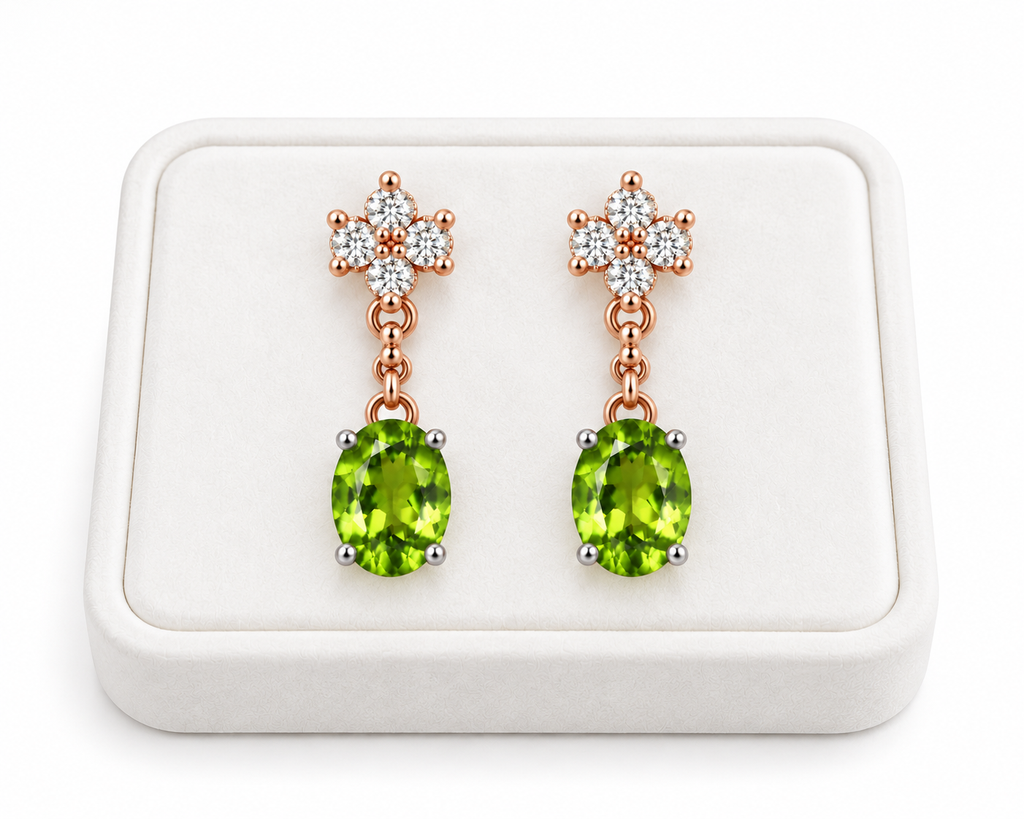 Natural 6x8mm peridot drop earrings displayed on a white velvet jewelry tray