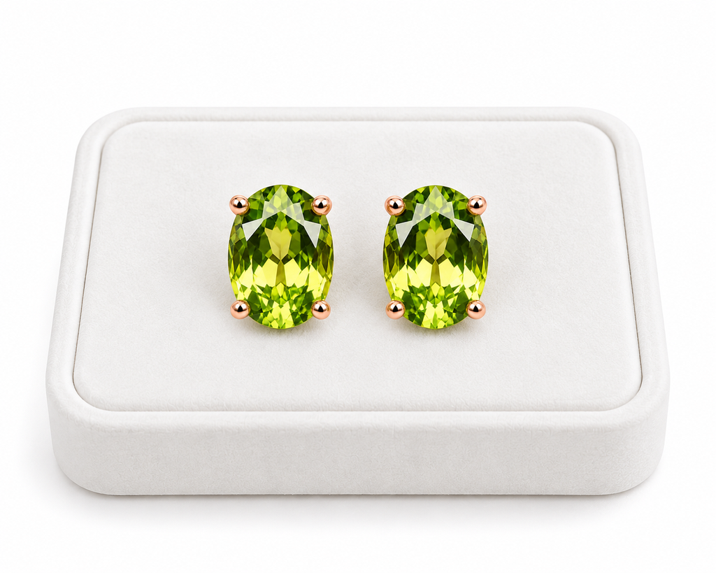 5x7mm natural peridot earrings displayed on a white velvet jewelry tray