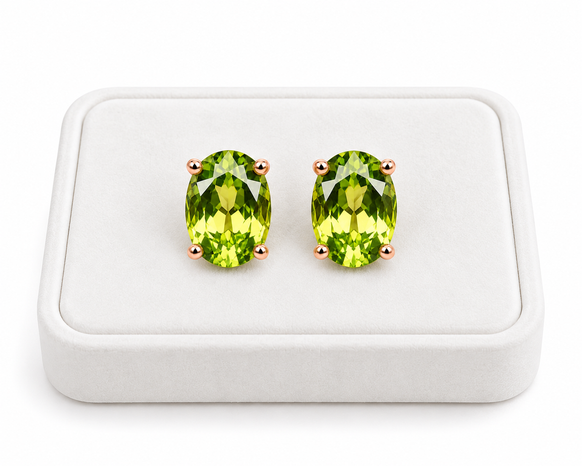 5x7mm natural peridot earrings displayed on a white velvet jewelry tray
