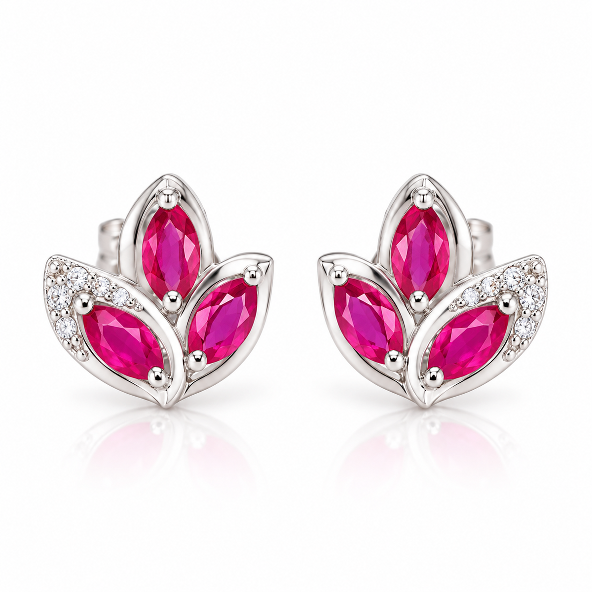 Natural pink ruby marquise stud earrings featuring three 2.5×5mm ruby gemstones per earring in a floral-inspired design on a white background.